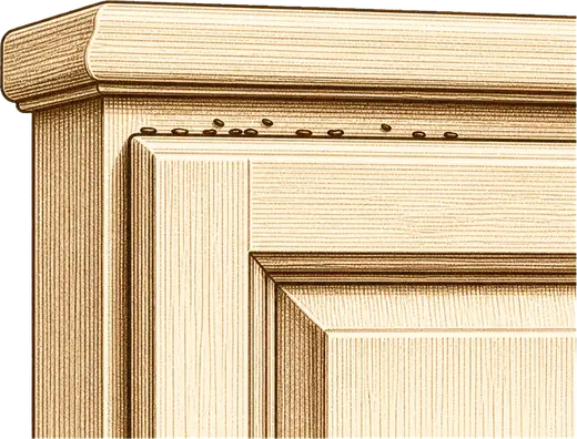 Dark specks along a cabinet edge